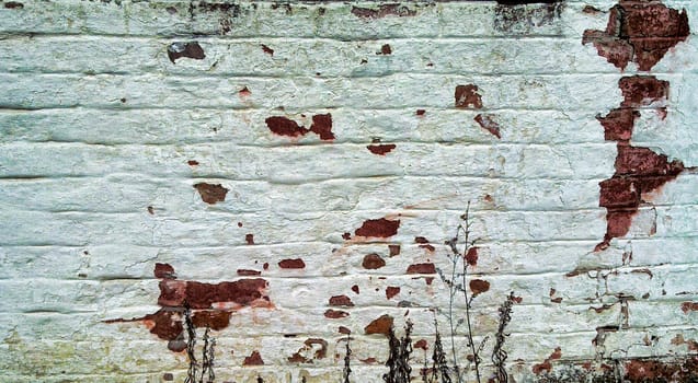 White old brick wall in need of repair