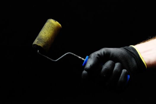 Brush  and a Hand on a Black Background