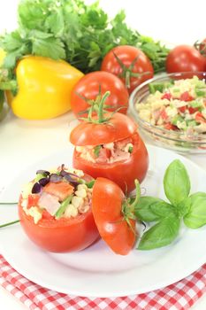 stuffed Tomatoes with pasta salad on a light background