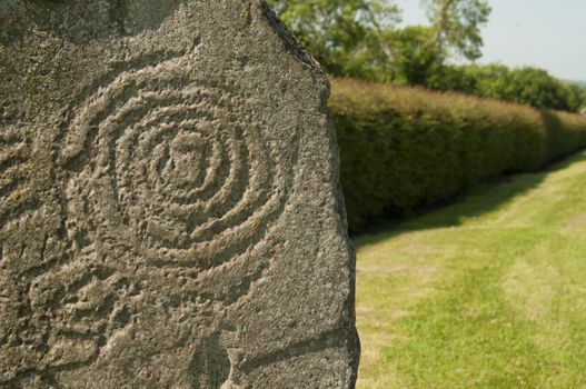 It is a Celtic and pre-Celtic symbol found on a number of Irish Megalithic and Neolithic sites, most notably inside the Newgrange passage tomb, on the entrance stone, and on some of the curbstones surrounding the mound.