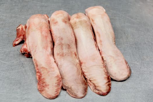 Image of four raw pork tongue for gourmet