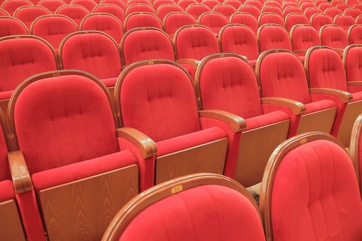 Background of many red theatrical red chairs