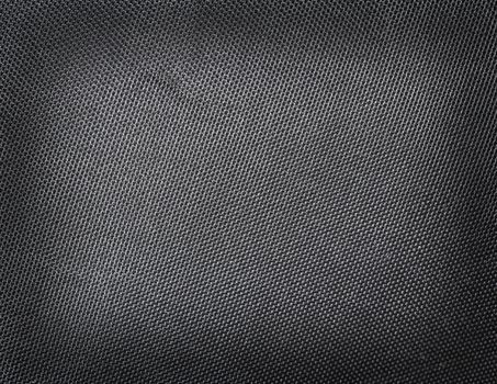 Black polyester texture background. Close up