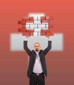 Businessman holding a large piece of a brick wall, flag of Switzerland, isolated on national flag