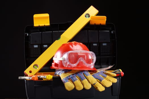 Safety gear kit close up over black