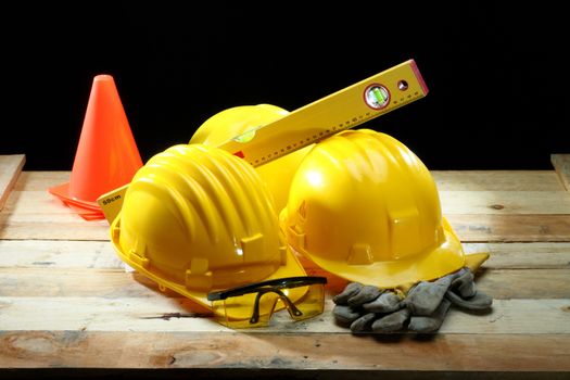 Three yellow helmets close up