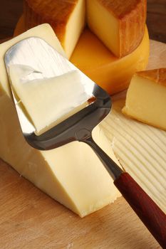 Grated cheese with grater, close up