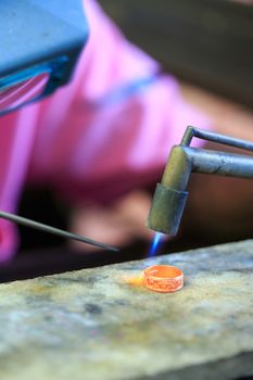 Goldsmith working with a thai traditional ring