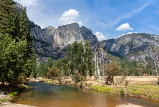The Merced River threads through Yosemite National Park. This image shows a stretch flowing through Yosemite valley.