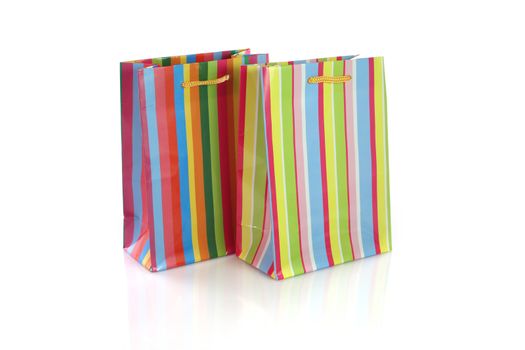 Empty shopping bags with rainbow pattern and yellow ribbon