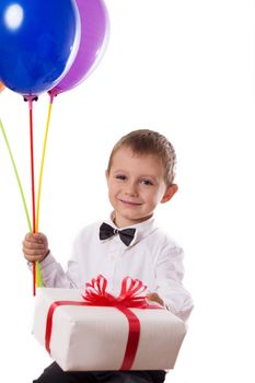Cute boy with balloons and giftbox isolated on white