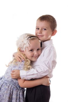 Sweet brother and sister hugging isolated on white