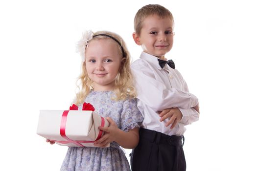 Smiling boy and girl with present box isolated on white
