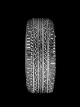 A black rubber tyre isolated against a white background