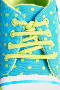 Baby sneaker with lace - colorful background