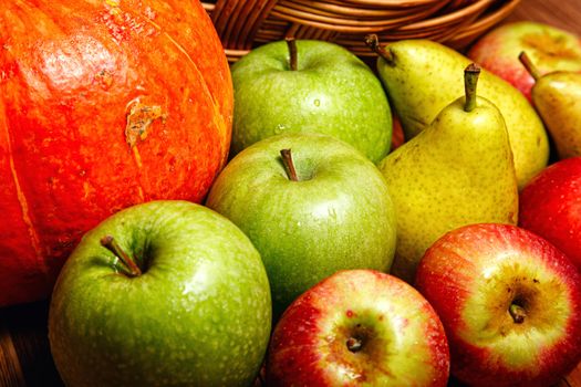 Harvest of ripe fruits and vegetables: apples, pears and pumpkin