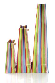 Empty shopping bags with rainbow pattern and yellow ribbon