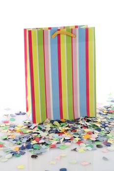 Empty shopping bag with rainbow pattern and yellow ribbon