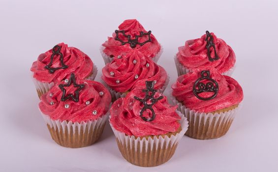 Group of Christmas cupcakes on white background