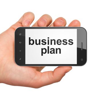 Hand holding smartphone with word business plan on display. Generic mobile smart phone in hand on white background.