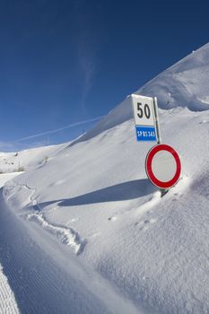 Caution sign in the snow