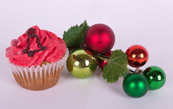 Christmas tree ornament and cupcake with bell