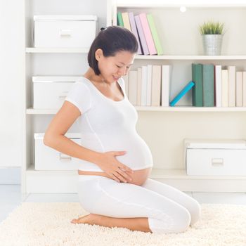 Asian 8 months pregnant woman relax at home. Pregnancy relaxation. 