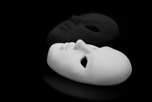 Black and white mask on black background.