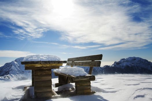Bench in winter landscape