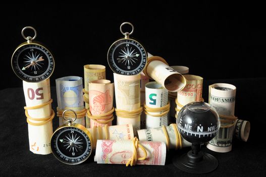 Orientation in  Business Compass and Money on a Black Background