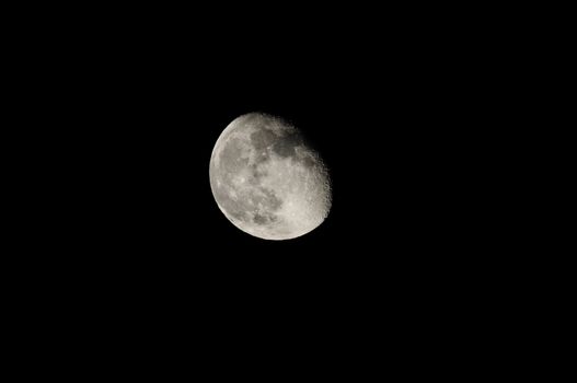 Almost Full Moon over a Dark Black Sky