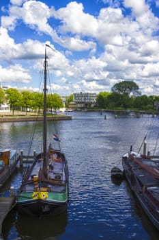 many ships parked near the shore in Amsterdam