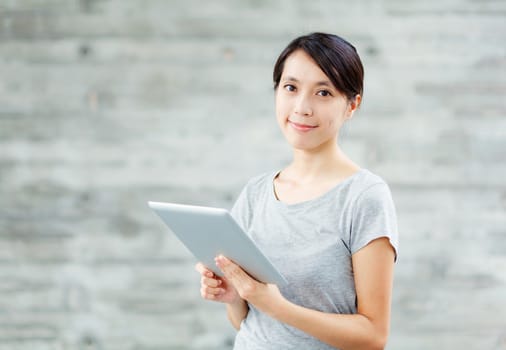 Asian woman with digital tablet