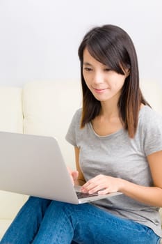 Asian woman using laptop