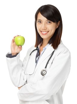 Asian female doctor holding green apple