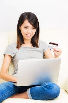 Asian woman using laptop for online shopping