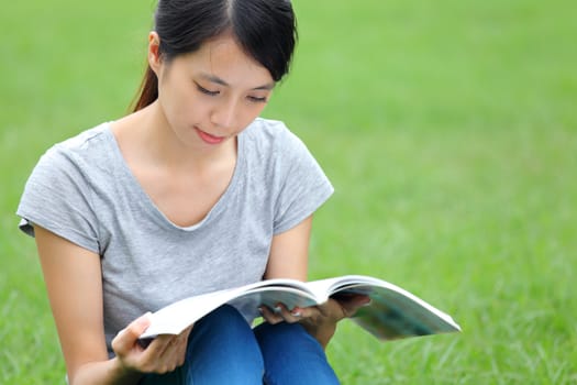 Asian woman reading book