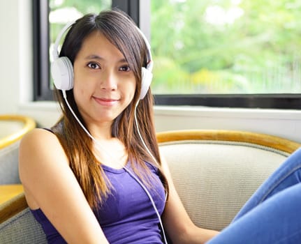 Asian woman listen to music