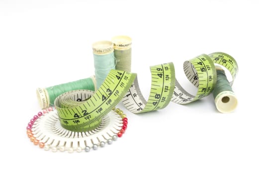 Various sewing kit equipment on a white background