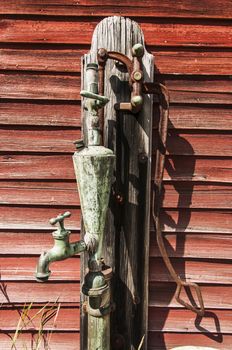 old water pump in a gas station in Maine, Usa