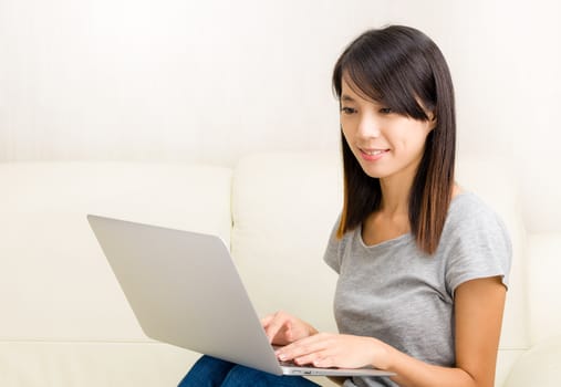 Asian woman using laptop