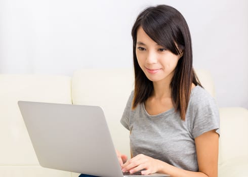 Asian woman using laptop