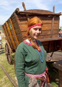 KHOTYN - MAY 10: Unidentified smiling redheaded girl during Festival Medieval Khotyn on May 10, Ukraine