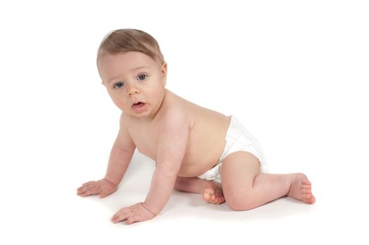 Side view of beautiful crawling baby in white background