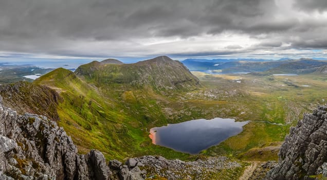 Panoramic view of Scottish highlands, mountains in Loch Assynt area, United Kingdom