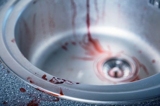 Close-up shot of bloody kitchen sink, Halloween or crime theme 