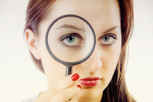 An image of Women with magnifying glass over her lips