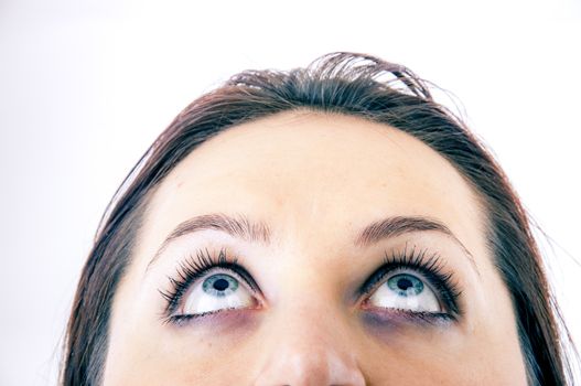 An image of young girl looking up
