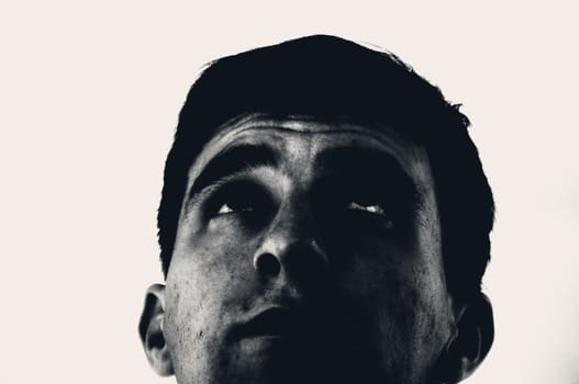 An image of young man staring up