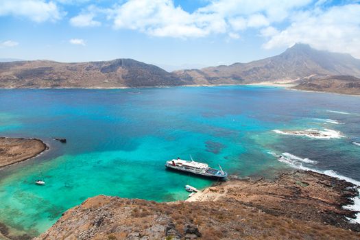 Cruise liner in beautiful lagoon with turquoise water, Gramvousa island, Greece 